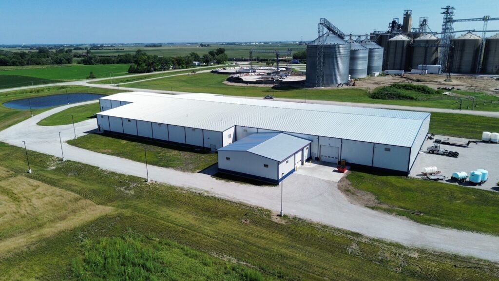 PEMB pre engineered metal building in Iowa that was built by stueve construction with grain storage in the background