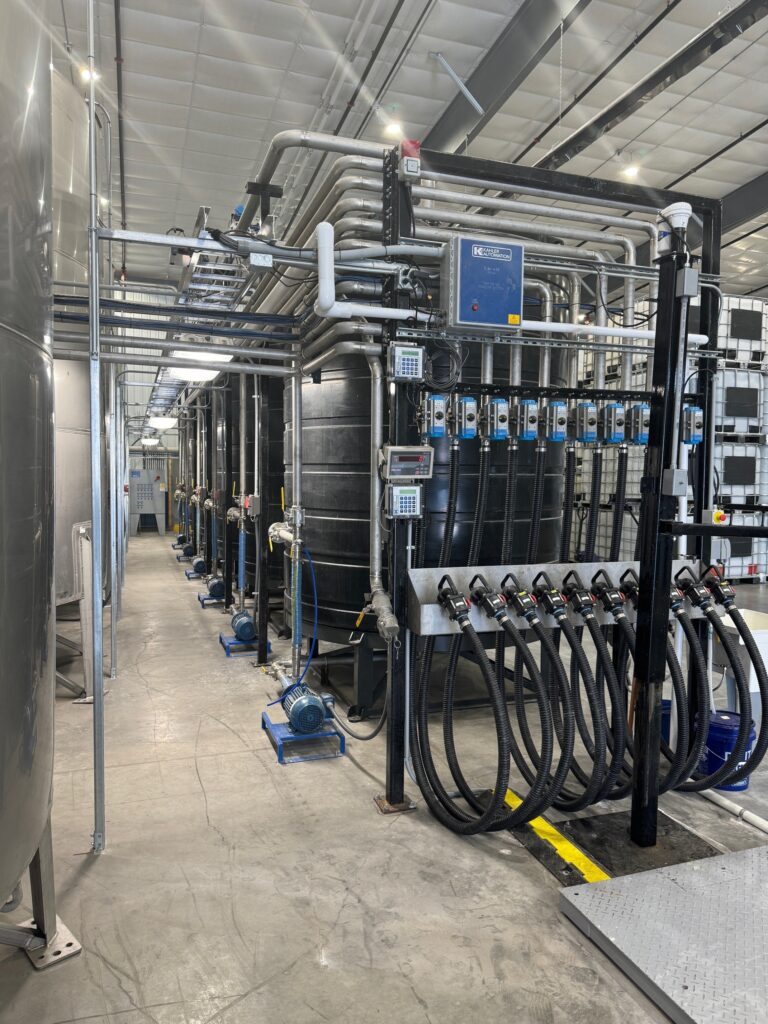 Modern ag chemical plumbing system in warehouse with automation in a stueve building