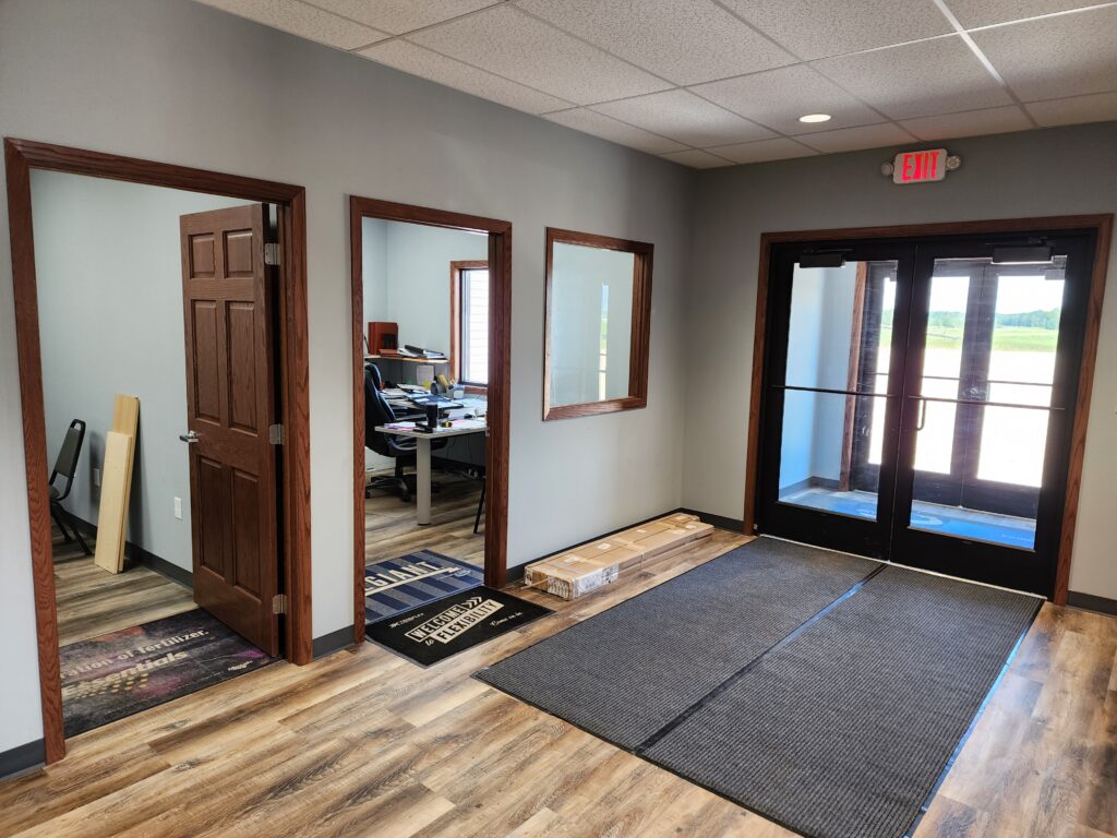 Inside a fertilizer blending warehouse office shows doors and windows