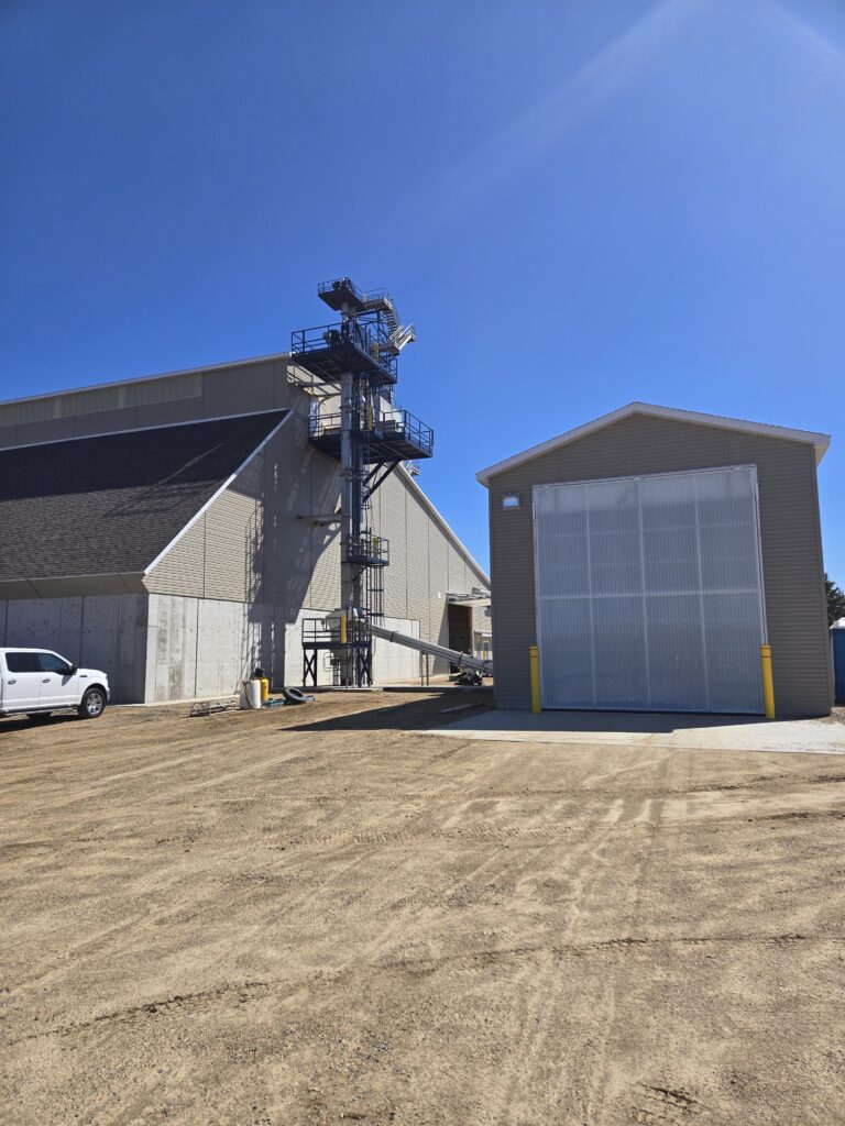 CHS Fertilizer Building with covered bottom dump trailers structure