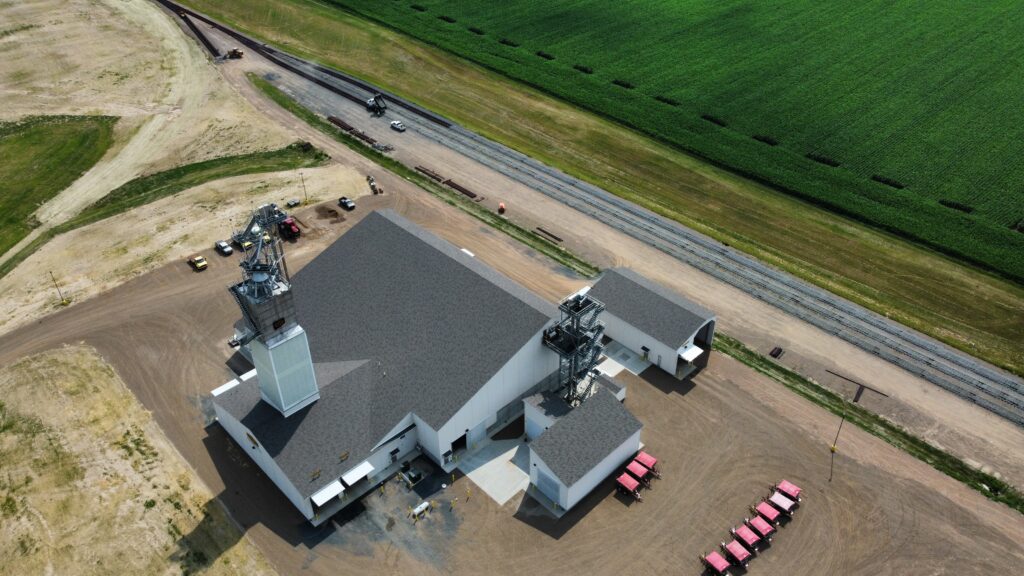 farm fertilizer storage building in Wisconsin alongside of Rail tracks with spreaders