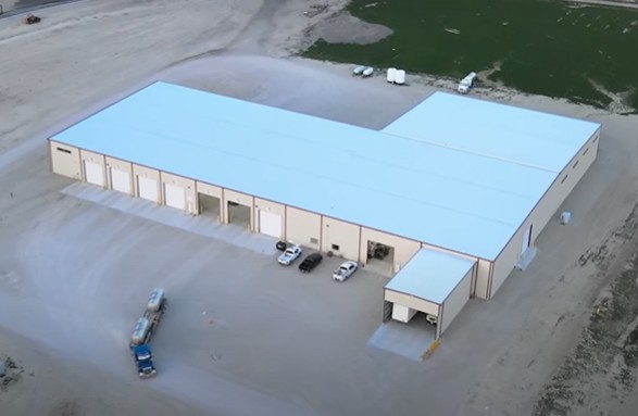 ovehead view of a metal Liquid fertilizer building built by Stueve Construction with farm trucks moving