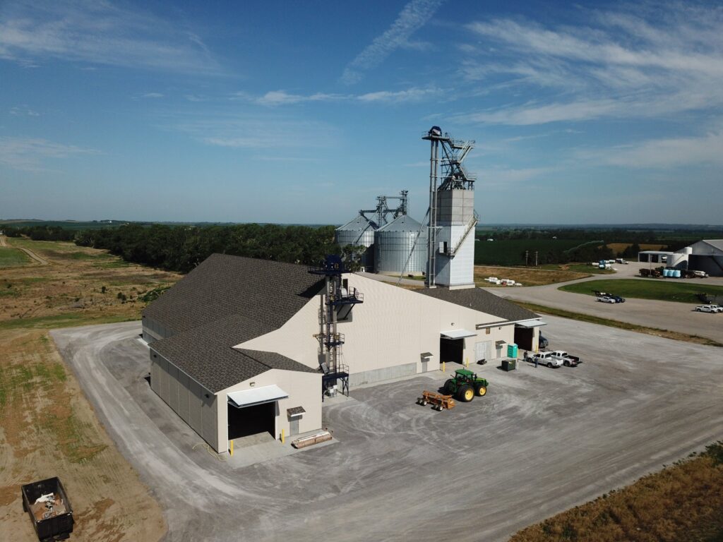 Granular fertilizer storage an blending building with covered truck receiving and sackett blend tower