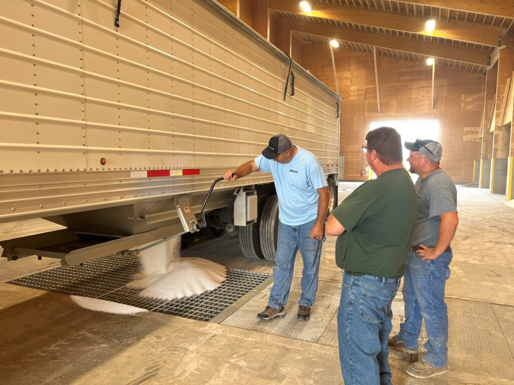 unloading plant micro nutrient fertilizer in side a fertilizer shed