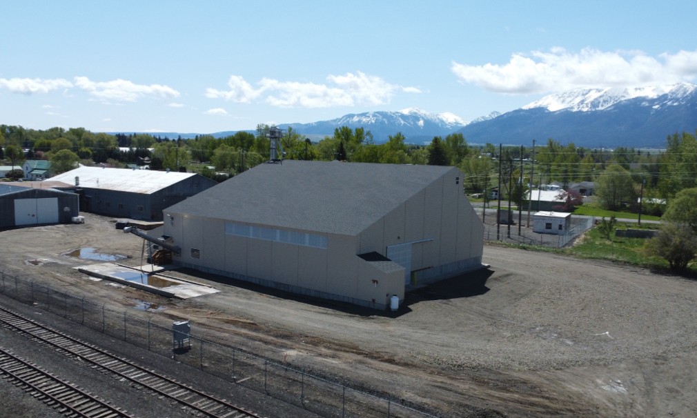 Dry fertilizer plant with mountains and farms in the back ground