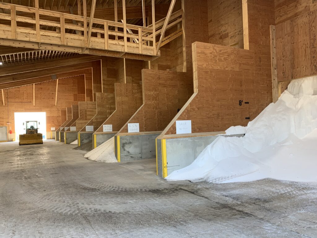 inside of dr fertilizer building with different types of bulk plant food