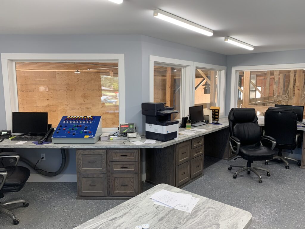 Agronomy facility office insode a fertilizer building load out area with desks and computers