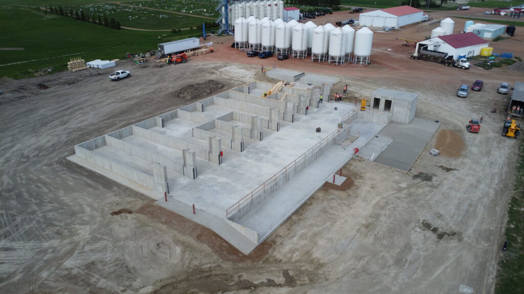 New dry fertilizer plant being built in with concrete and seed tanks at ag retail facility