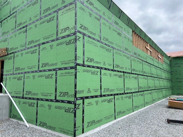green zip board sheathing on new fertilizer storage building with taped seams