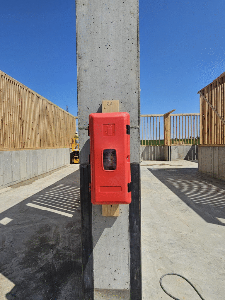 Fire extinguisher on fertilizer building construction job site