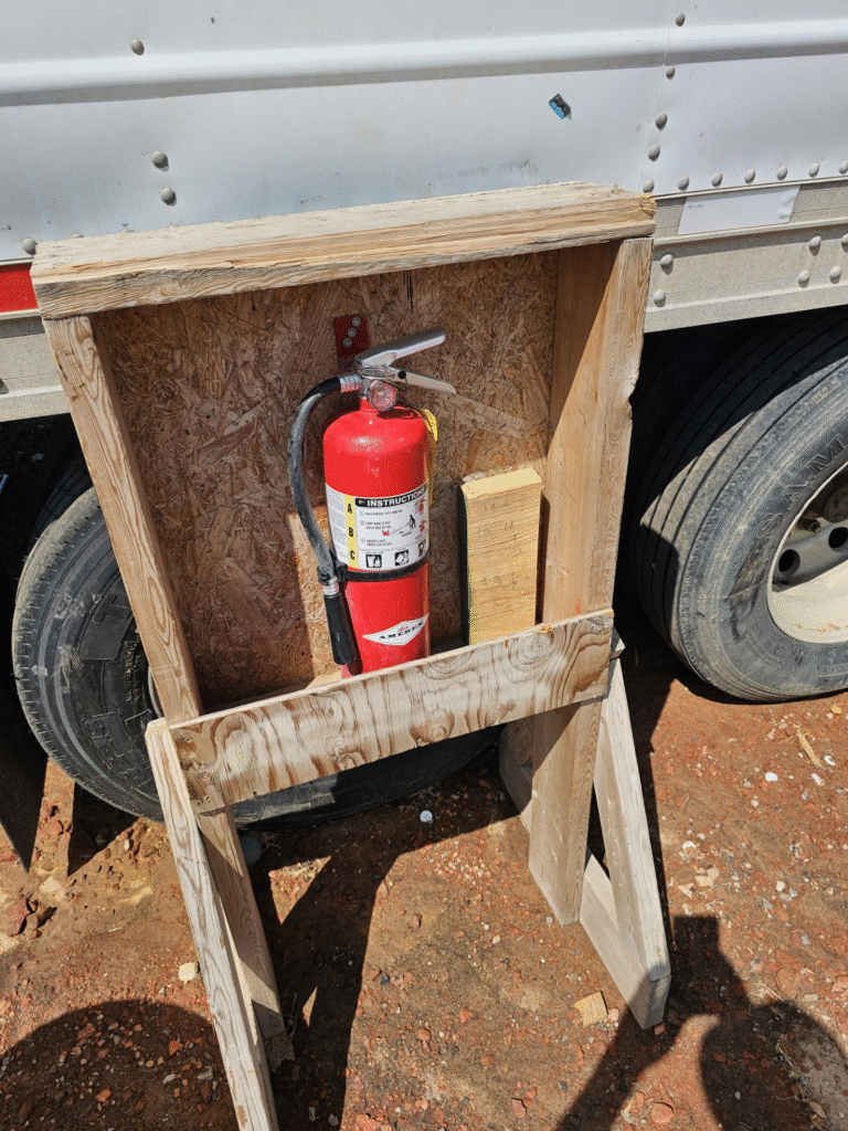 Fire extinguisher on fertilizer building construction job site trailer