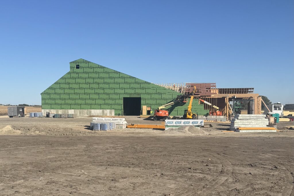 dry fertilizer storage and blending building under construction with green zip board sheathing